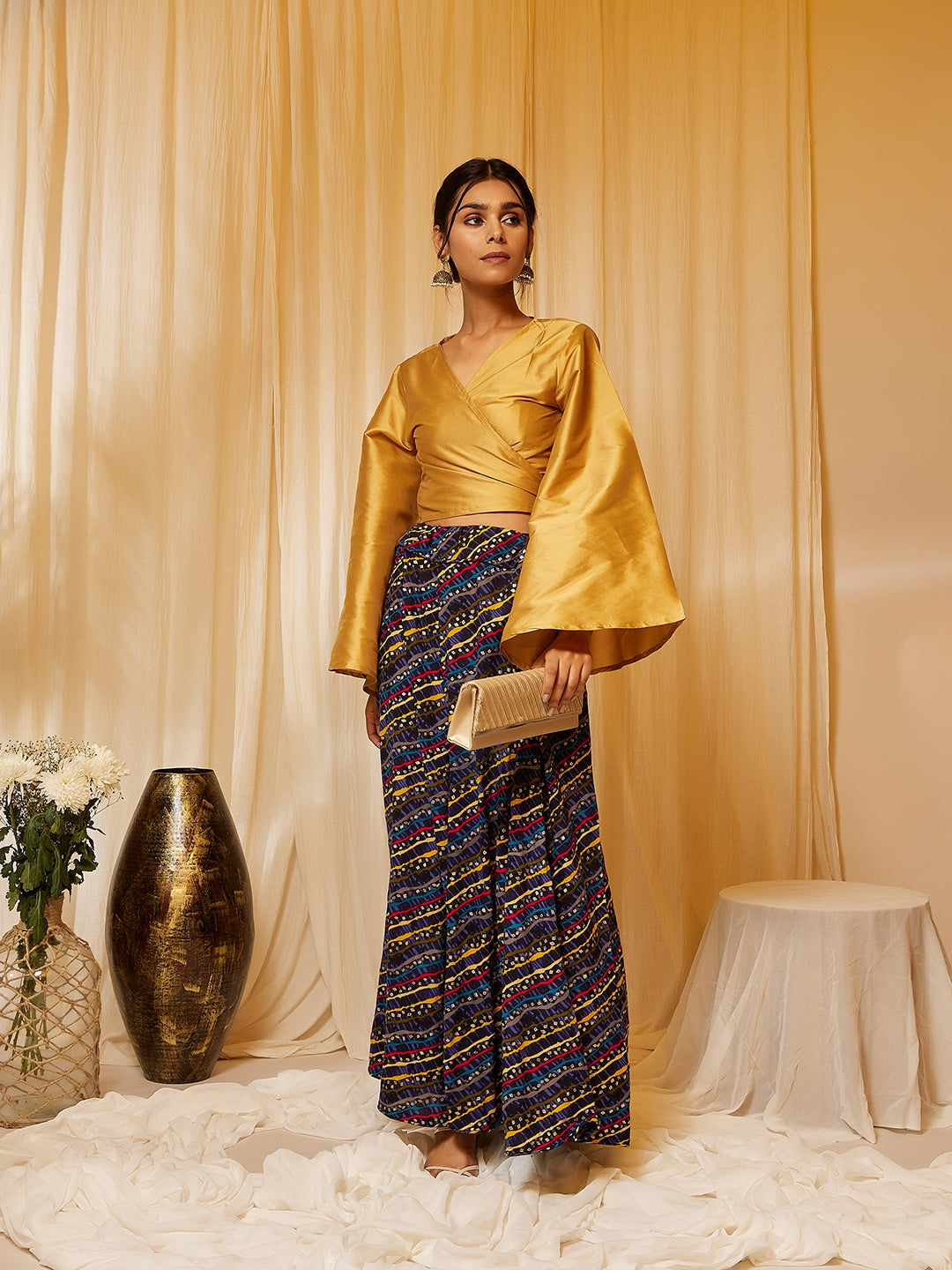GOLD TOP WITH MUSTARD LEHARIYA SKIRT