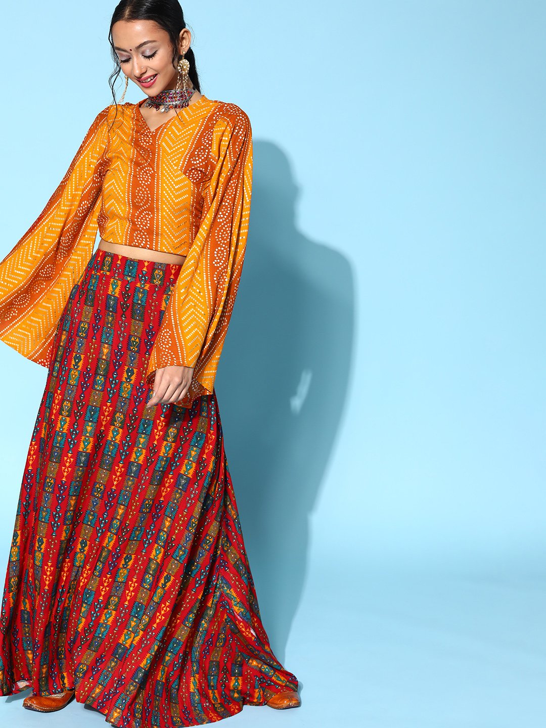 Yam Orange Bandhani Crop Top With Red Abstract Skirt Set